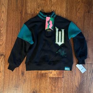 NWT Wicked Musical Movie Boys’ Pullover - Green/Black XS Shiz Oz Glinda Elphaba